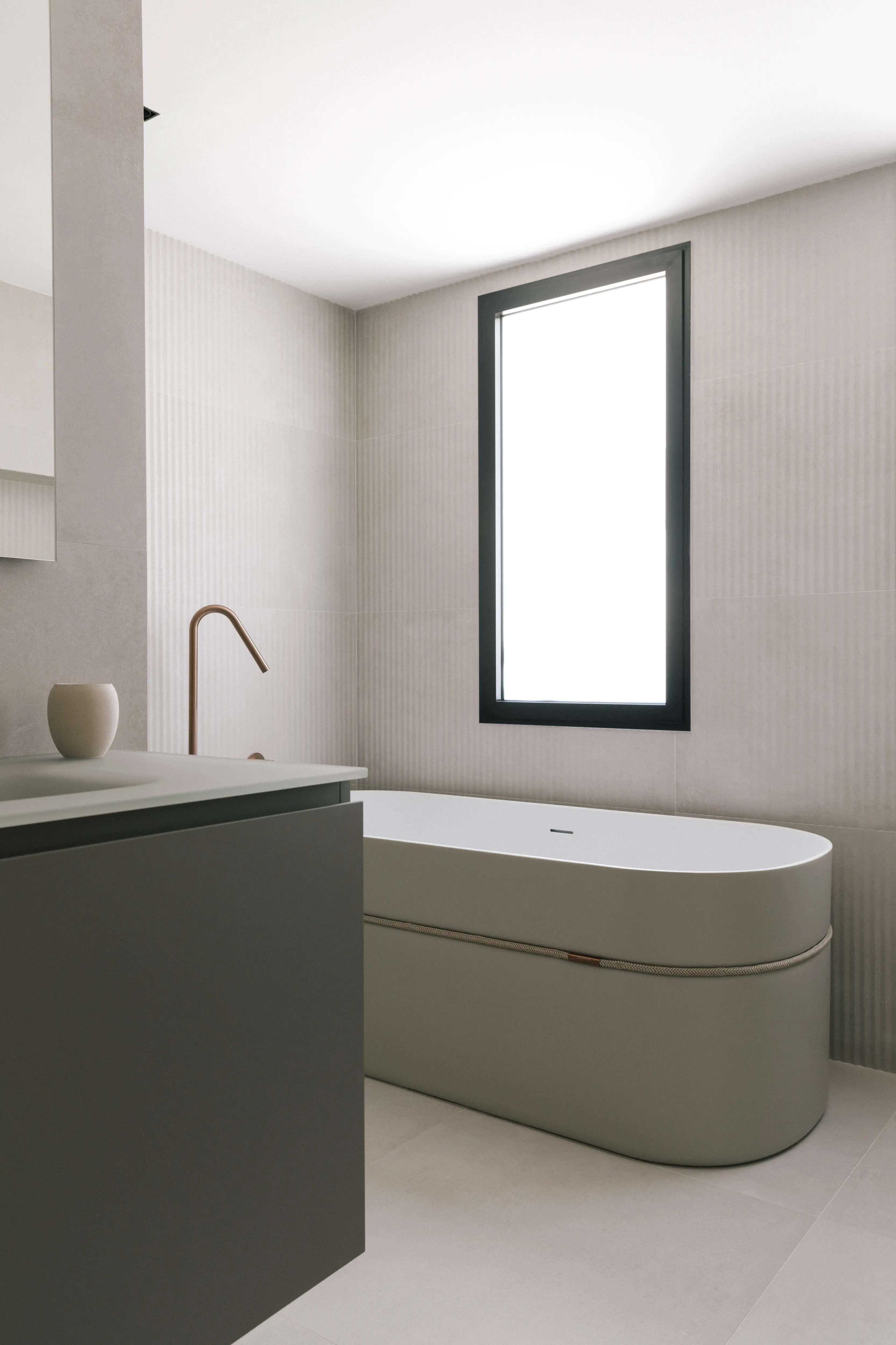 Rénovation de salle de bains in Valence with modern finishes, stone, storage, and éclairage