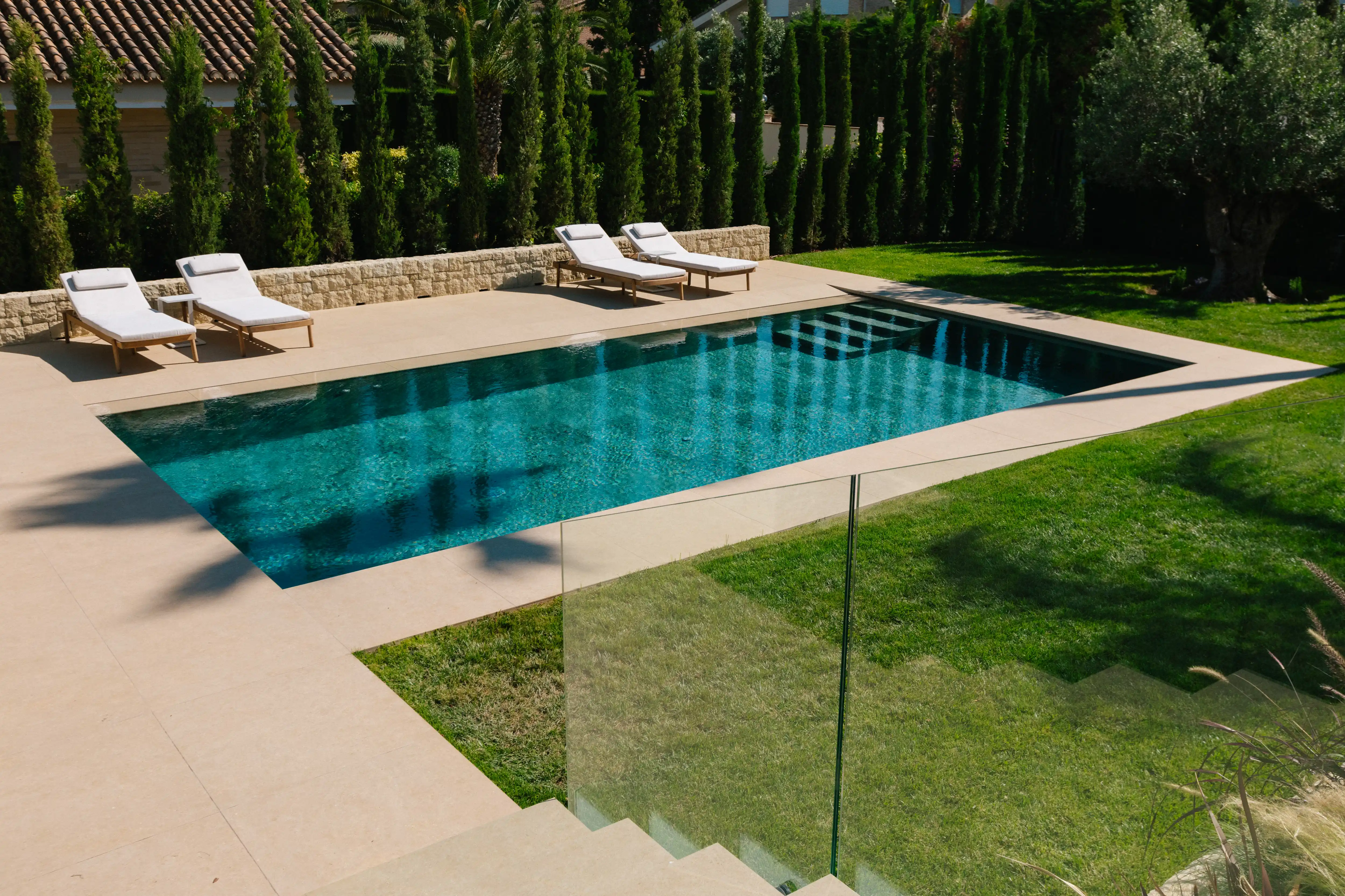 Outdoor terrace and pool area after rénovation de villa in Campolivar Valence image 78